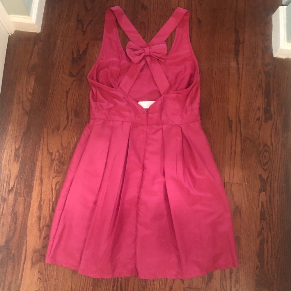 NWT Pink dress with bow and criss cross back strap